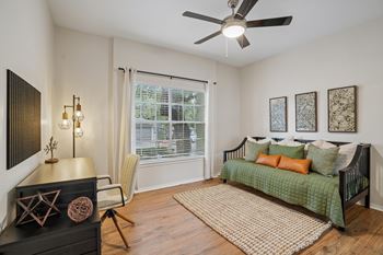 Guest room with daybed and ceiling fan